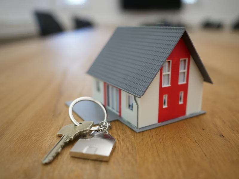 House model with keys representing a new home in Charleston